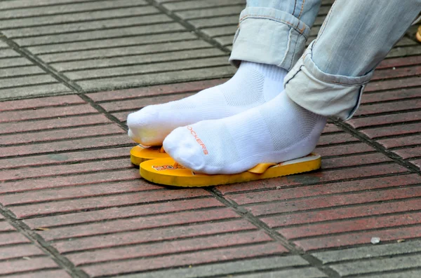 Male feet in white socks