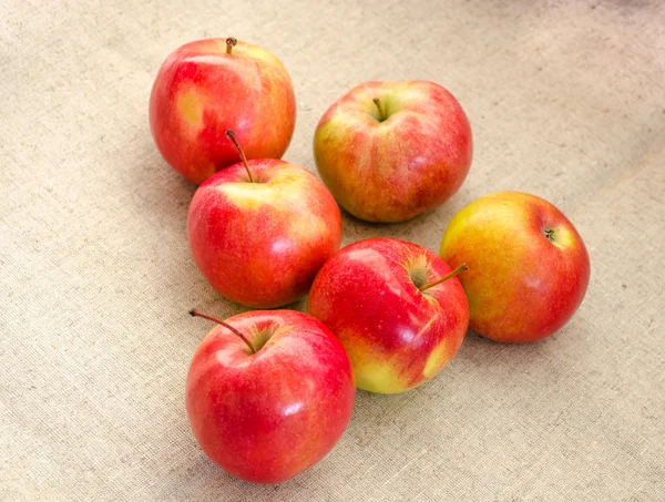 Six juicy, beautiful, big red apples on a white background