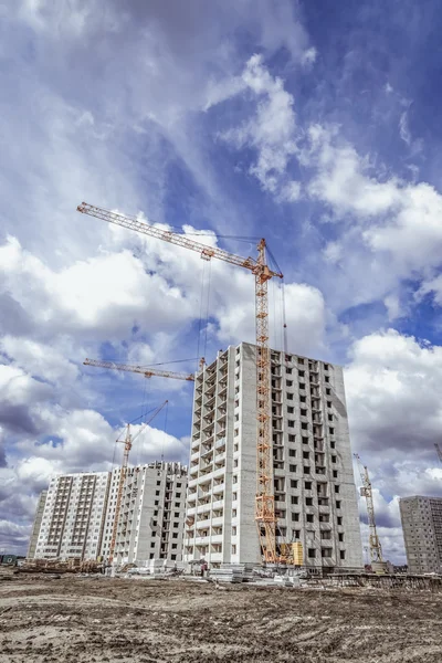 Housing development and industrial cranes