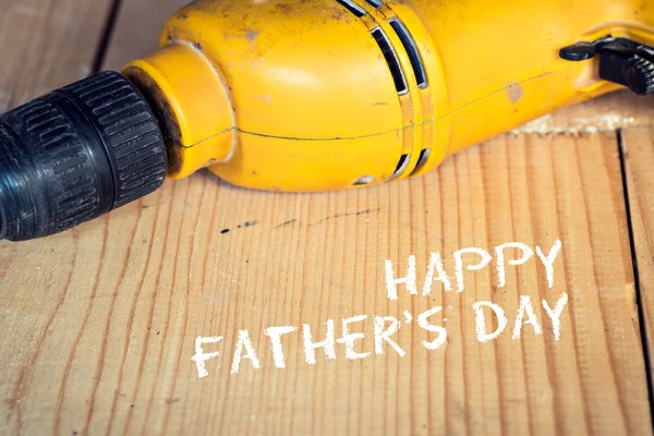Fathers day concept, Electric well used power drill, close up with copy space