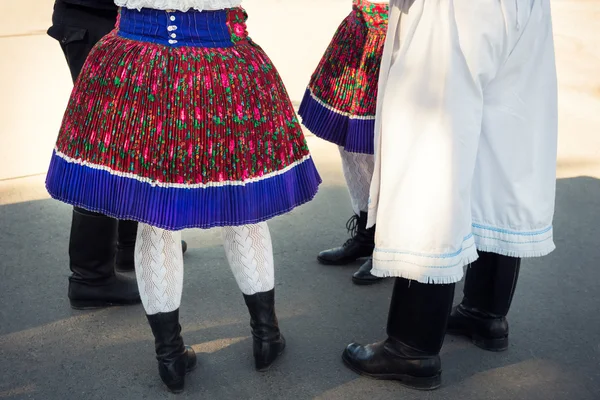 Anonymous group of people in folklore costumes