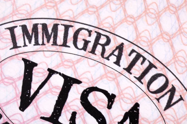 Immigration visa stamp passport page close up