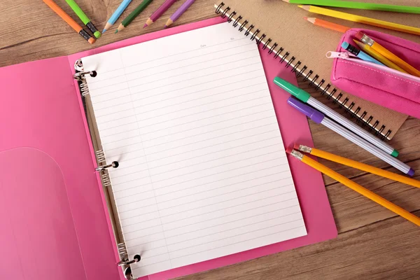 Student's desk with pink project folder