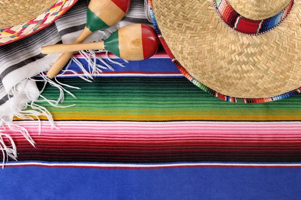 Mexican background with traditional blanket and sombrero
