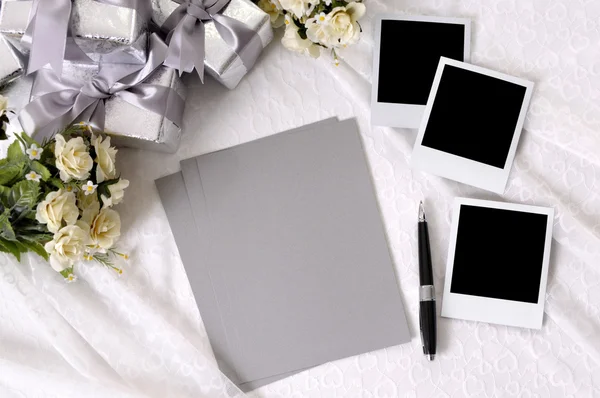 Wedding gifts with writing paper and photos