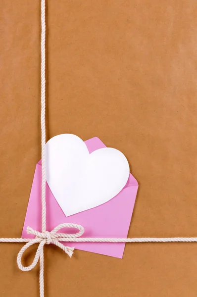 Valentines day gift with heart shape card or gift tag, brown pap