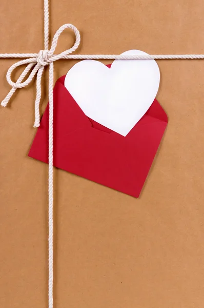 Valentines day gift with white heart shape card, red envelope, b