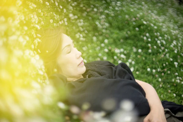 Woman lay down flower garden