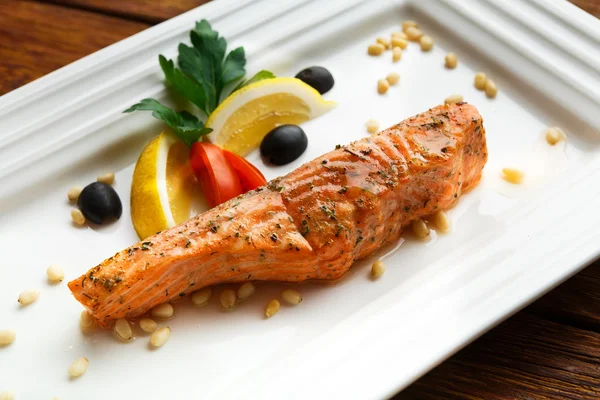 Restaurant food - grilled salmon with lemon.
