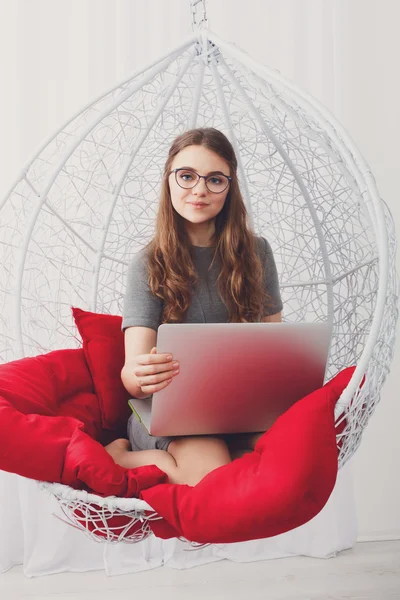 Stylish woman high key portrait with laptop.