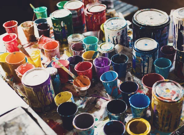 Multicolored cans with paint, arts background