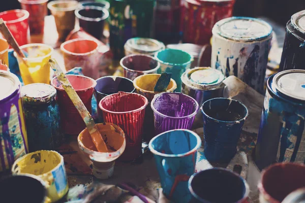Multicolored cans with paint, arts background