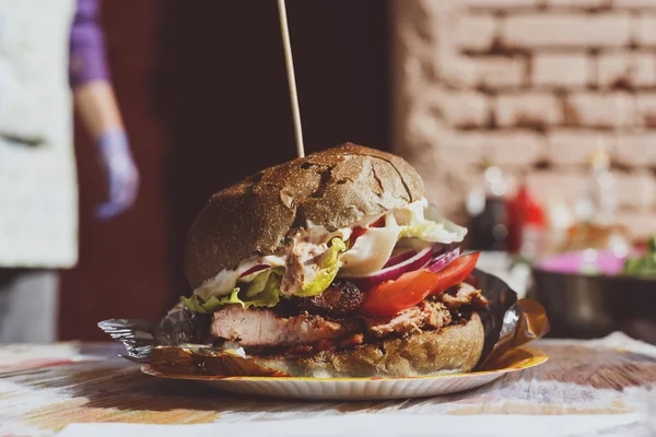 Street fast food, hamburger with bbq grilled steak