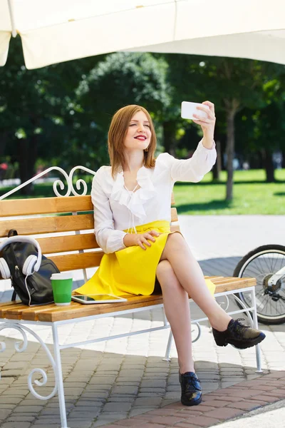 Young woman with tablet pc in the park