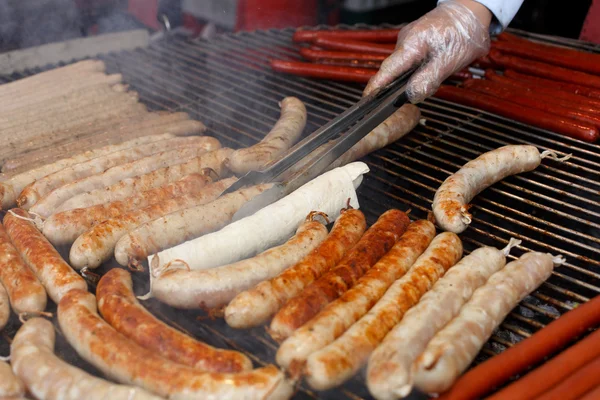 Street fast food, grilled sausages at bbq