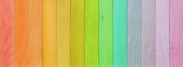 Colorful wooden planks rainbow painted background
