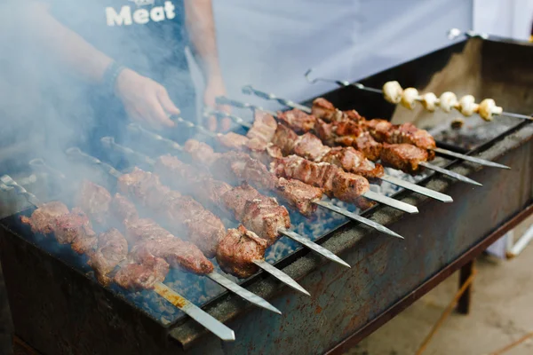 Grilled kebab on metal skewer, barbecue