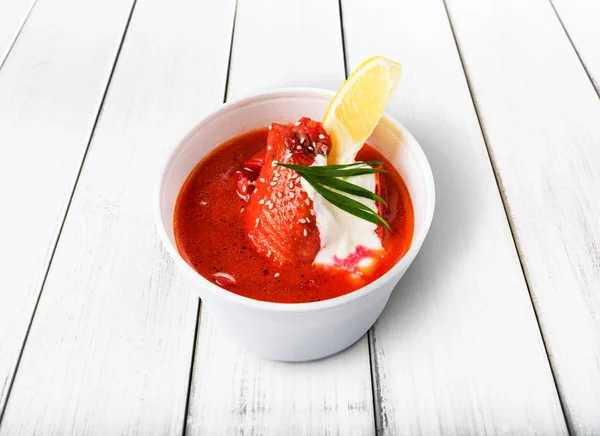 Food take away, russian soup borsch on white wood