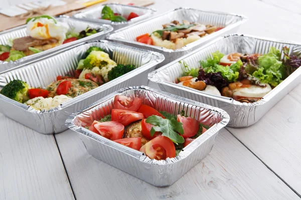 Healthy food in boxes, diet concept.