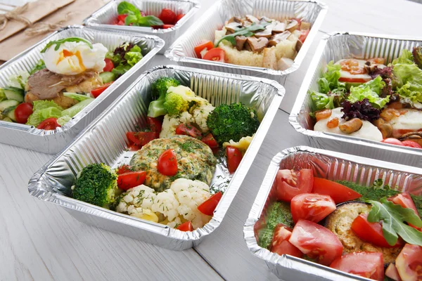 Healthy food in boxes, diet concept.