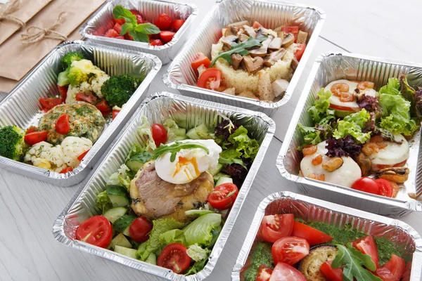 Healthy food in boxes, diet concept.