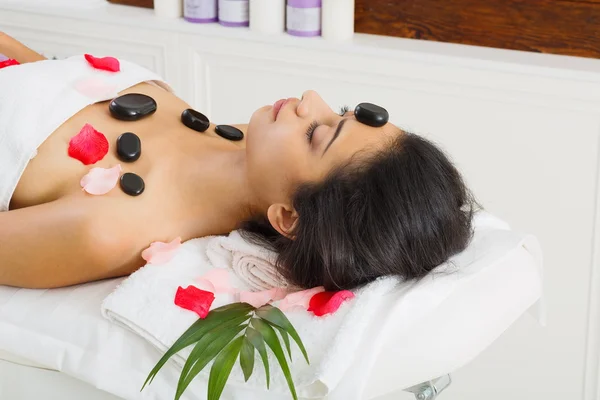 Balck marble stone massage spa for woman at wellness center