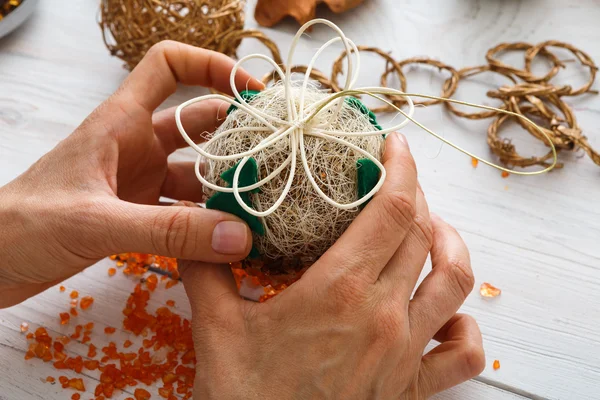 Creative diy hobby. Handmade craft christmas decoration, balls and garland