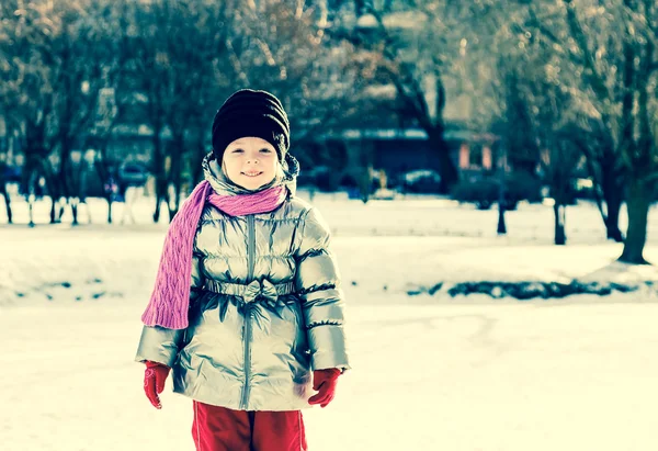 Portrait of little girl outdoors in winter