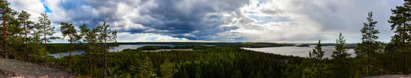 Beautiful panorama with forest and lake after rain