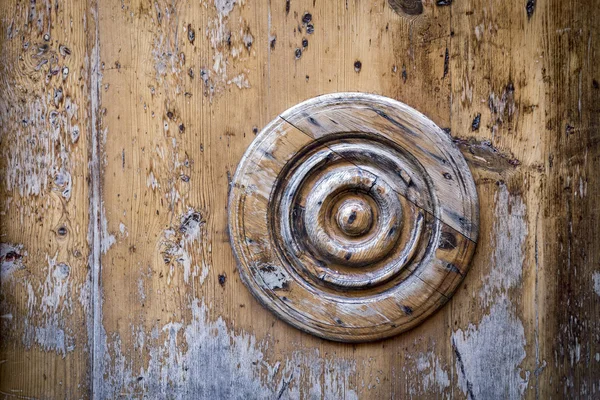 Decorative circle on an old wooden door