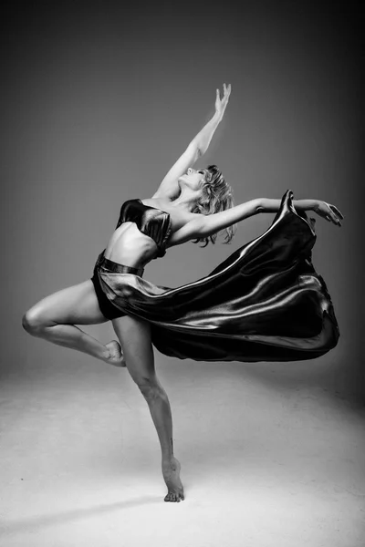 Woman dancer wearing blue skirt