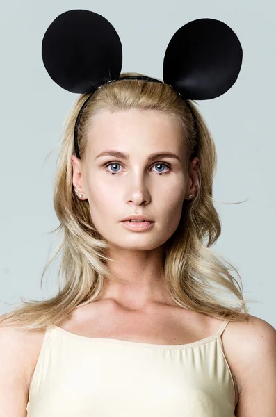 Blonde girl wearing mouse ears
