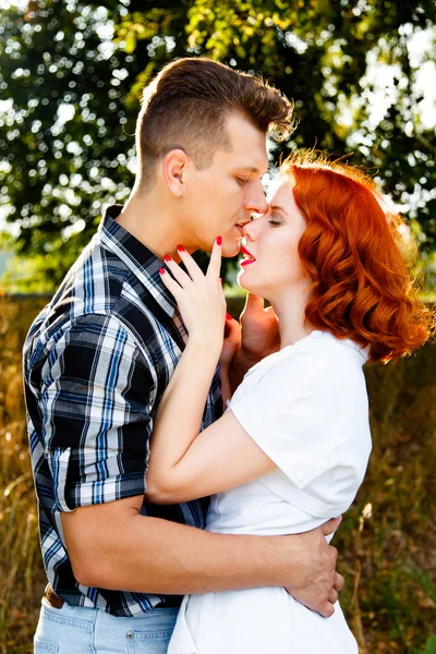Redheaded woman with man