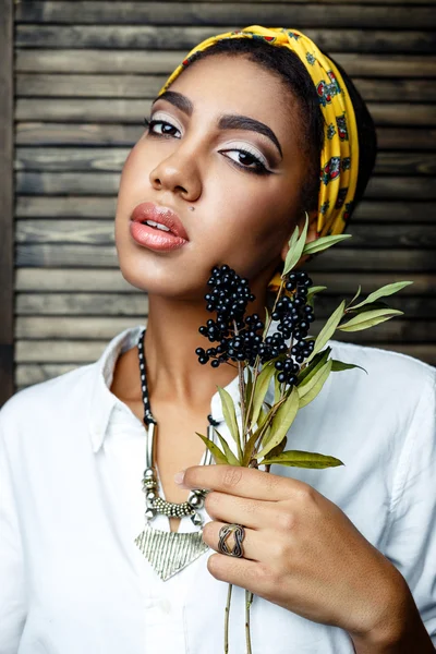 African- american  female model with flower