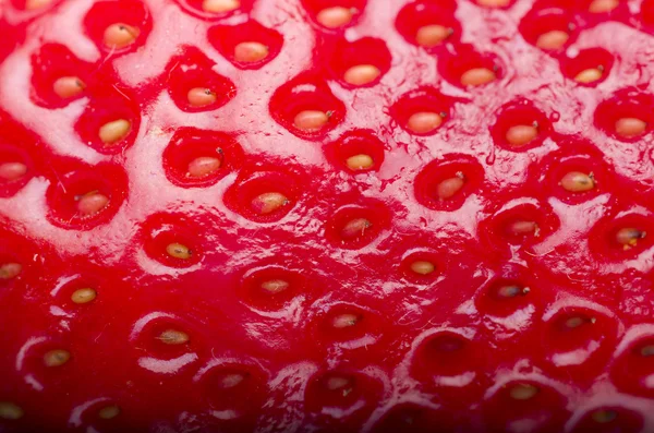 Fresh red strawberry texture close up, macro.