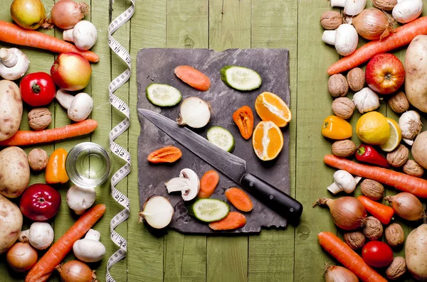Fresh vegetables and fruits on vintage background - detox, diet or healthy food concept