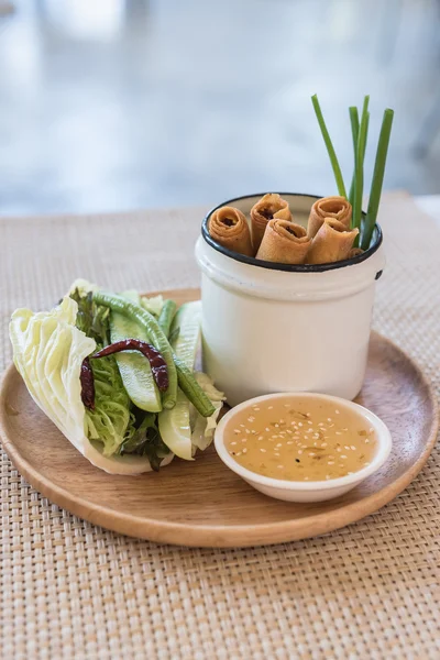 Plate of spring rolls with sweet chili dip sauce