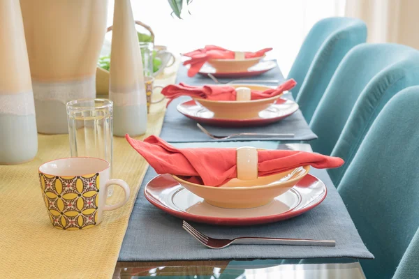 Table set on dining table in colorful dining room