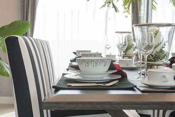 Table set on wooden table in luxury dining room