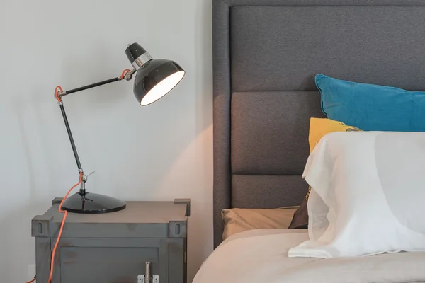 Modern black lamp on table side in modern bedroom