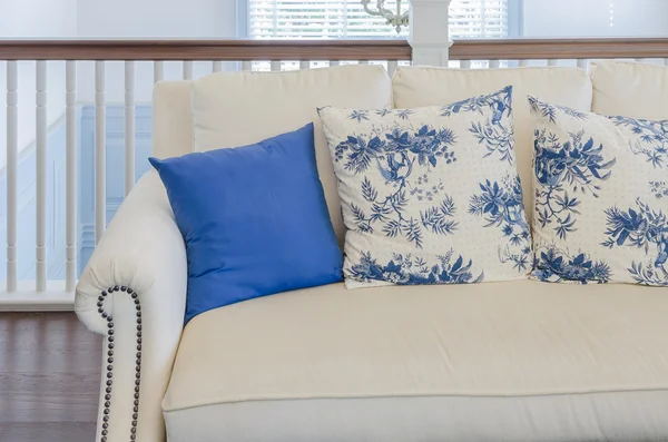 Blue pillow on beige sofa in luxury living room