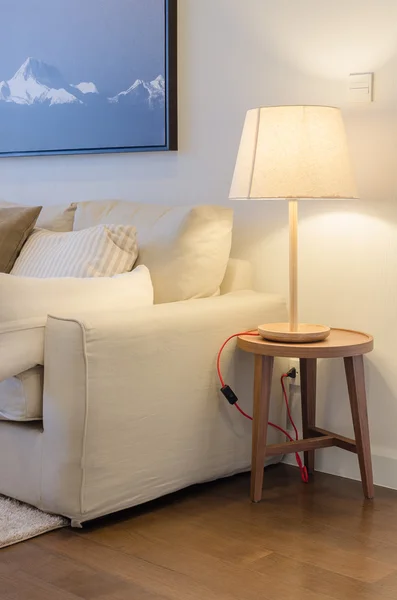 Earth tone color sofa with lamp