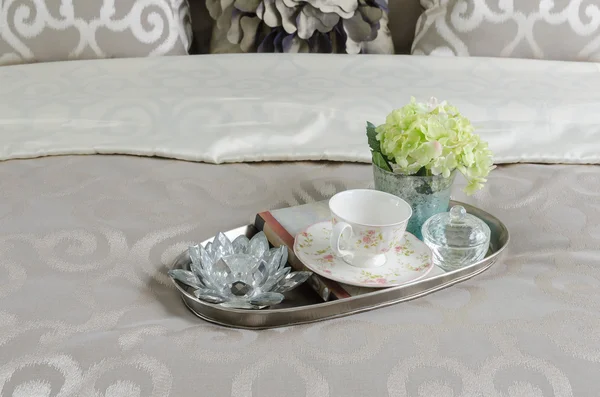 Tray of tea cup and plant in luxury bedroom
