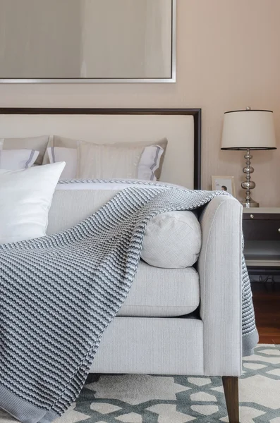 Luxury grey sofa on carpet in luxury bedroom