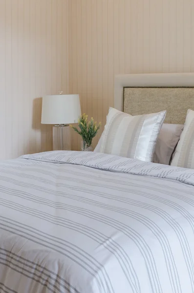 Luxury bedroom with white lamp and plants