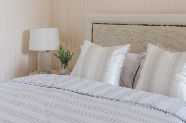 Luxury bedroom with white lamp and plants