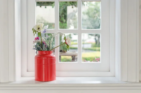 Vase of flower with window frame