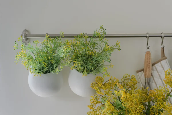 Bowl of plants hang on bar rail