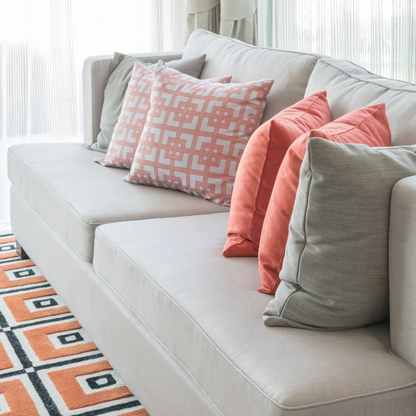 Row of pillows on sofa in classic living room style