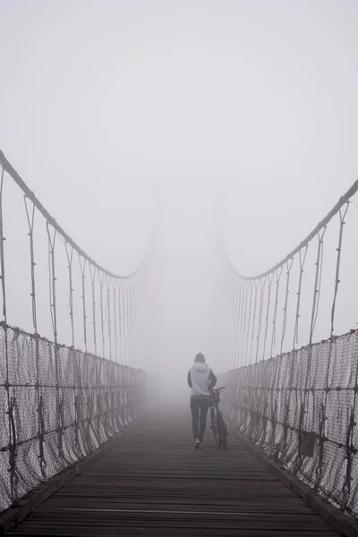 Girl walking in to the mist ,Thailand